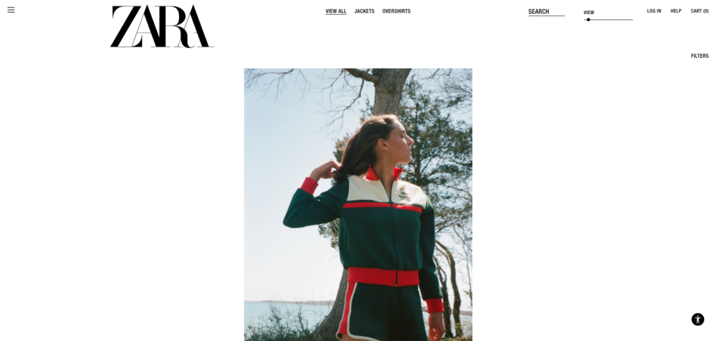 A screenshot of ZARA's browsing page. A single image of a woman wearing a stylish jacket is in the centre of the screen.